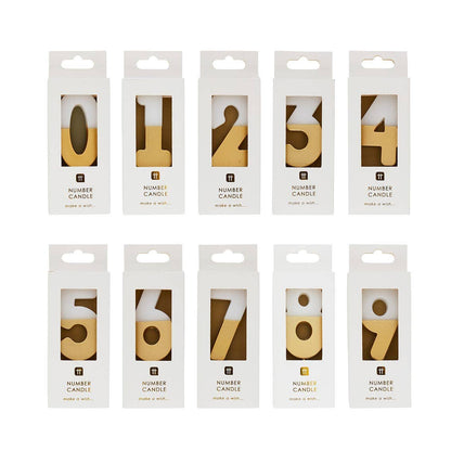 Ten boxed white and gold number candles in two rows, 0 to 9