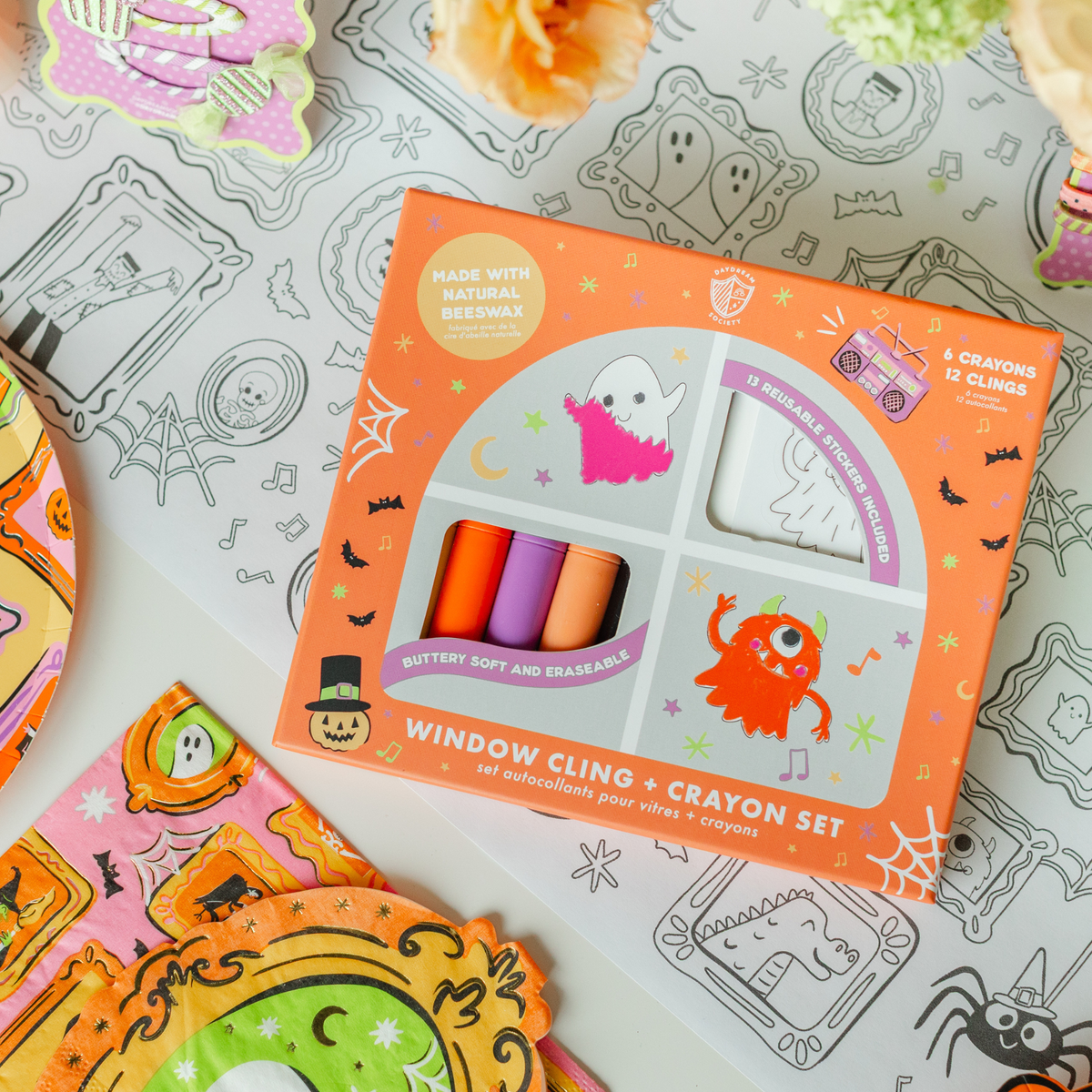 Monster Mash box on a Halloween table setting with ghost-print plates and spooky decorations
