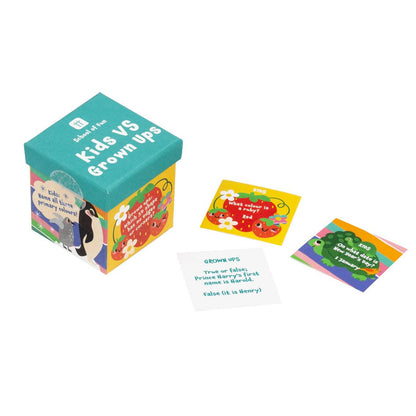 Teal Kids VS Grown Ups trivia box beside question cards