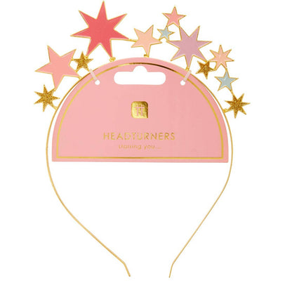 Gold-tone headband topped with pink, purple and gold stars on its pink display card